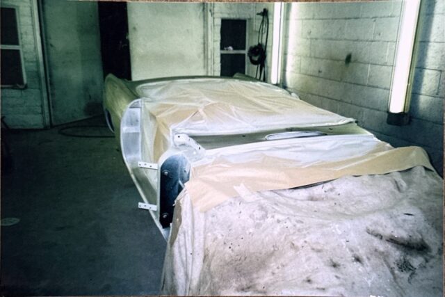 MGB Roadster under dust sheet